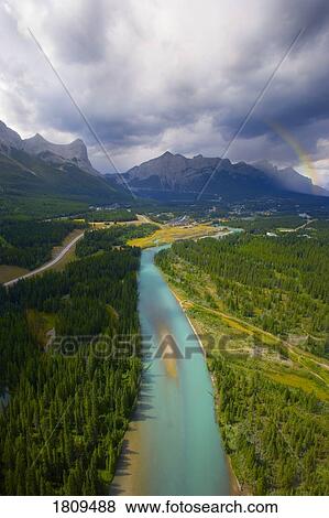 Stock Photo - Aerial view of Bow River and Canmore, Alberta. Fotosearch