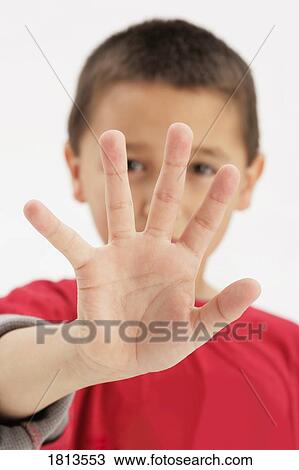 Stock Image - Boy showing hand. Fotosearch