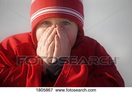 Boy warming hands outside View Large Photo Image Stock Photo - Boy warming hands outside. Fotosearch