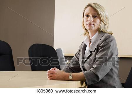 Businesswoman in a meeting room View Large Photo Image Stock Image - Businesswoman in a meeting room. Fotosearch