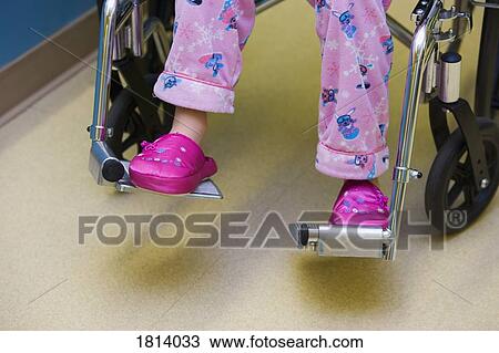 Stock Image - Child in hospital wheelchair . Fotosearch