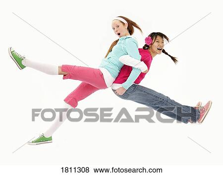 Stock Photo - Chinese and caucasian girl playing. Fotosearch