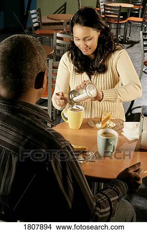 Couple at coffee shop View Large Photo Image Picture - Couple at coffee shop. Fotosearch