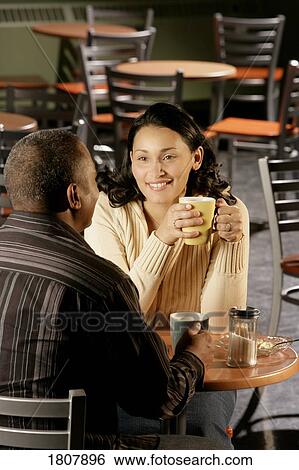 Stock Photograph - Couple at coffee shop . Fotosearch