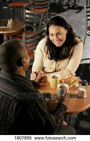 Couple at coffee shop View Large Photo Image Stock Photography - Couple at coffee shop. Fotosearch