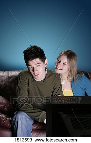 Stock Image - Couple watching television. Fotosearch