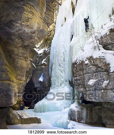 Family watching an ice climber on a frozen waterfall, Jasper National Park, Alberta, Canada View Large Photo Image Stock Photo - Family watching an ice climber on a frozen waterfall, Jasper National Park, Alberta, Canada. Fotosearch