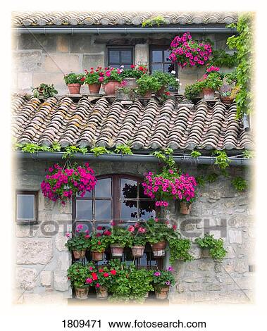 Flower pots in windows in Arles, Provence, France View Large Photo Image Stock Image - Flower pots in windows in Arles, Provence, France. Fotosearch
