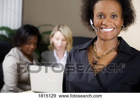 Front view of a business woman in office View Large Photo Image Stock Photo - Front view of a business woman in office. Fotosearch