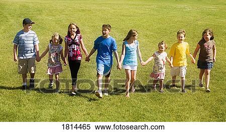 Stock Photography - Front view of children walking. Fotosearch