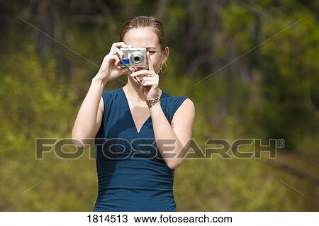 Front view of female photographer View Large Photo Image Stock Image - Front view of female photographer. Fotosearch