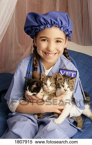 Front view of girl sitting with cats View Large Photo Image Stock Photography - Front view of girl sitting with cats. Fotosearch