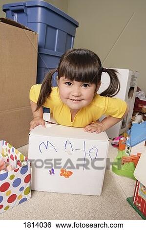 Front view of girl with box View Large Photo Image Stock Photograph - Front view of girl with box. Fotosearch