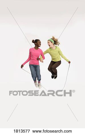 Front view of girls skipping View Large Photo Image Stock Photo - Front view of girls skipping. Fotosearch