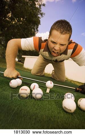 Frustrated golfer yelling at golf balls View Large Photo Image Stock Image - Frustrated golfer yelling at golf balls. Fotosearch