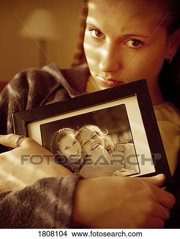 Picture - Girl experiencing loss over the death of her mother. Fotosearch
