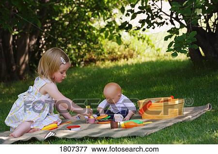 Stock Photo - Girl having a play picnic. Fotosearch