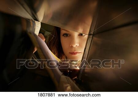 Girl taking mail out of post office box View Large Photo Image Stock Image - Girl taking mail out of post office box. Fotosearch
