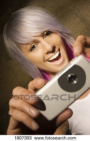 Girl taking picture with digital camera View Large Photo Image Stock Image - Girl taking picture with digital camera. Fotosearch