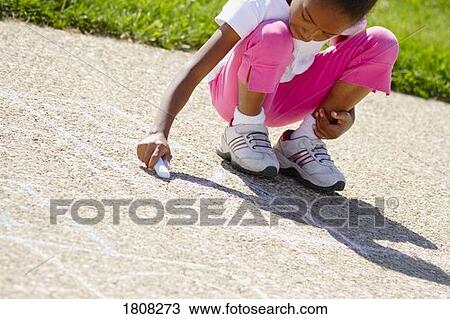 Girl writing with chalk on sidewalk View Large Photo Image Stock Image - Girl writing with chalk on sidewalk. Fotosearch