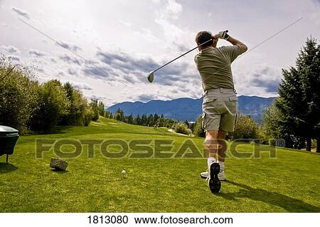Stock Image - Golfer misses the ball. Fotosearch
