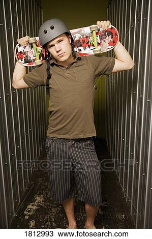 Stock Image - Guy with skateboard. Fotosearch