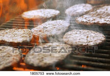 Hamburger patties cooking on grill View Large Photo Image Stock Image - Hamburger patties cooking on grill . Fotosearch