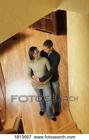 High angle view of couple standing in hall View Large Photo Image Stock Photo - High angle view of couple standing in hall. Fotosearch