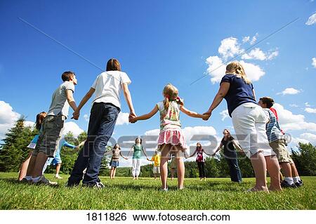 Holding hands in a circle View Large Photo Image Stock Photograph - Holding hands in a circle. Fotosearch