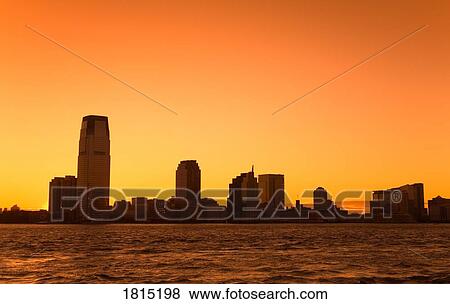 Stock Photo - Jersey City at sunset in New York City, New York, USA . Fotosearch