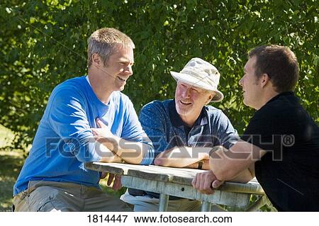 Stock Photo - Men laughing. Fotosearch