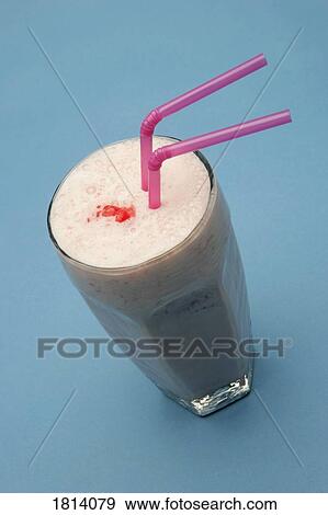 Stock Photo - Milkshake with two straws. Fotosearch