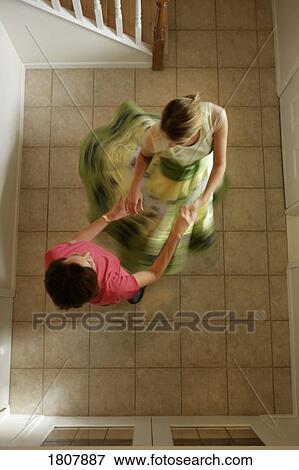 Mom and daughter dancing View Large Photo Image Stock Photo - Mom and daughter dancing. Fotosearch