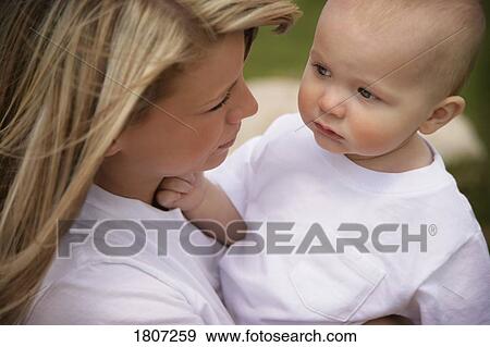 Mother adoring her child View Large Photo Image Stock Photo - Mother adoring her child . Fotosearch