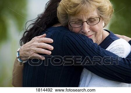 Stock Image - Mother and daughter embracing. Fotosearch