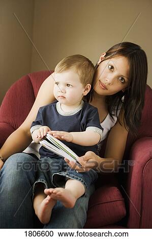 Mother sitting with boy View Large Photo Image Stock Image - Mother sitting with boy. Fotosearch
