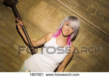 Portrait of woman leaning against railing View Large Photo Image Stock Image - Portrait of woman leaning against railing. Fotosearch