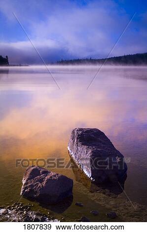 Rocks on the shore of Maligne Lake, Jasper National Park, Alberta, Canada View Large Photo Image Stock Photo - Rocks on the shore of Maligne Lake, Jasper National Park, Alberta, Canada. Fotosearch