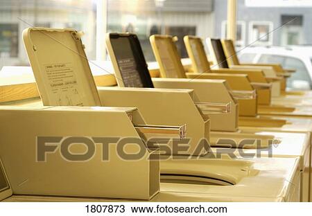 Stock Image - Row of washing machines. Fotosearch