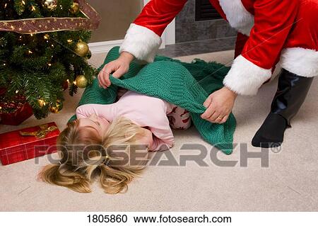 Santa putting a blanket over two sleeping kids View Large Photo Image Stock Image - Santa putting a blanket over two sleeping kids. Fotosearch