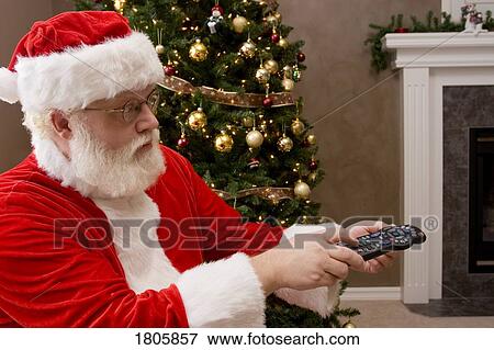 Santa using the remote control View Large Photo Image Stock Photo - Santa using the remote control. Fotosearch