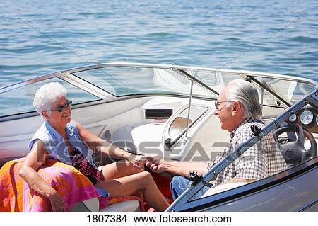 Senior couple boating View Large Photo Image Picture - Senior couple boating. Fotosearch