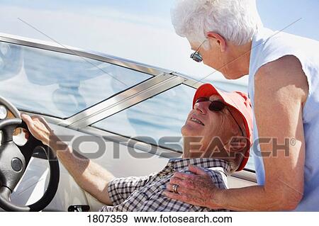 Senior couple boating View Large Photo Image Stock Photo - Senior couple boating. Fotosearch