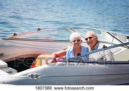 Stock Photo - Senior couple boating. Fotosearch