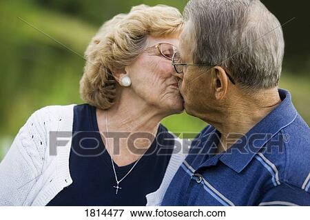 Stock Photo - Senior couple kissing. Fotosearch