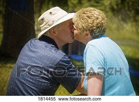 Stock Photography - Senior couple kissing. Fotosearch