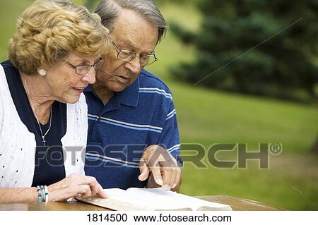 Senior couple reading the Bible View Large Photo Image Stock Image - Senior couple reading the Bible. Fotosearch