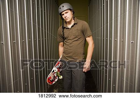 Skateboarder in metal room View Large Photo Image Stock Image - Skateboarder in metal room. Fotosearch