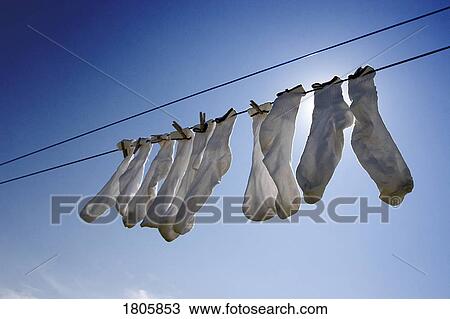 Socks hanging from a clothes line View Large Photo Image Stock Image - Socks hanging from a clothes line. Fotosearch