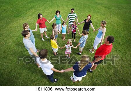 Standing in a circle View Large Photo Image Stock Photograph - Standing in a circle. Fotosearch